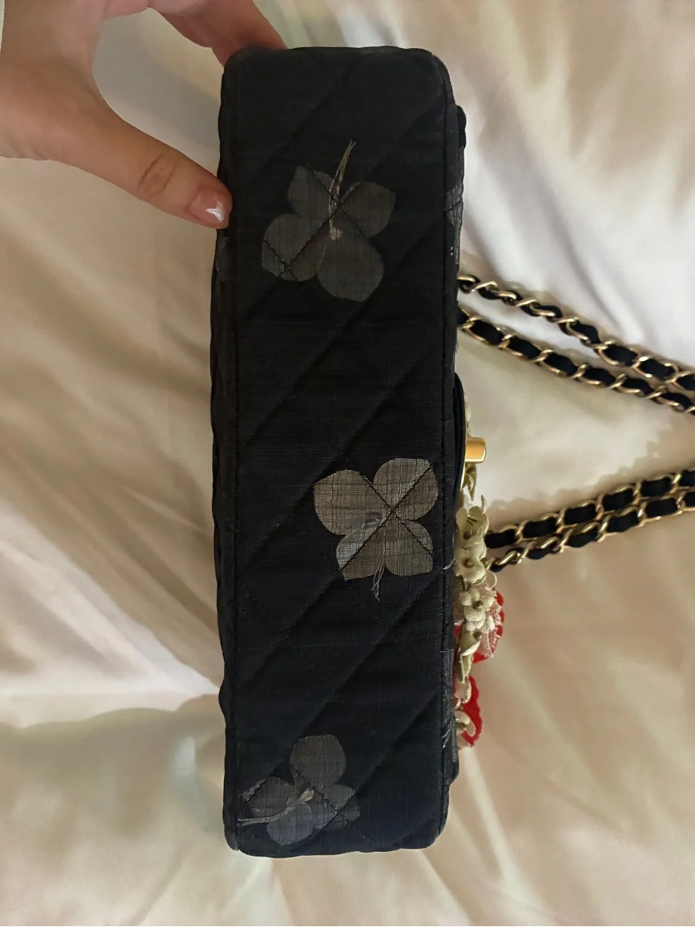 CHANEL Black Quilted Shoulder Bag with Red Floral Appliqués